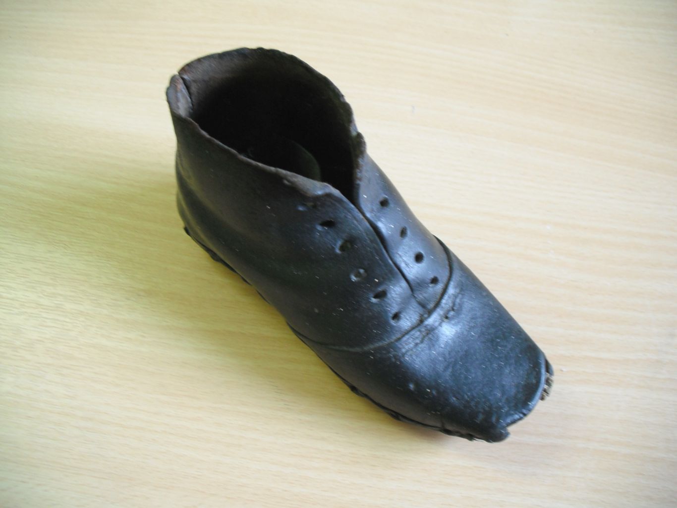 Figure 1. An 18th/19th-century child’s shoe found in the chimneybreast of a house in Ilkley, Yorkshire. Photograph by C. Houlbrook, April 2011
