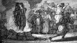 Woodcut illustration of a witch at the stake (By mullica - unknown.this file Flickr: Witch Burning, uploaded by Robert Benner (mullica), CC BY 2.0, https://commons.wikimedia.org/w/index.php?curid=15358452)