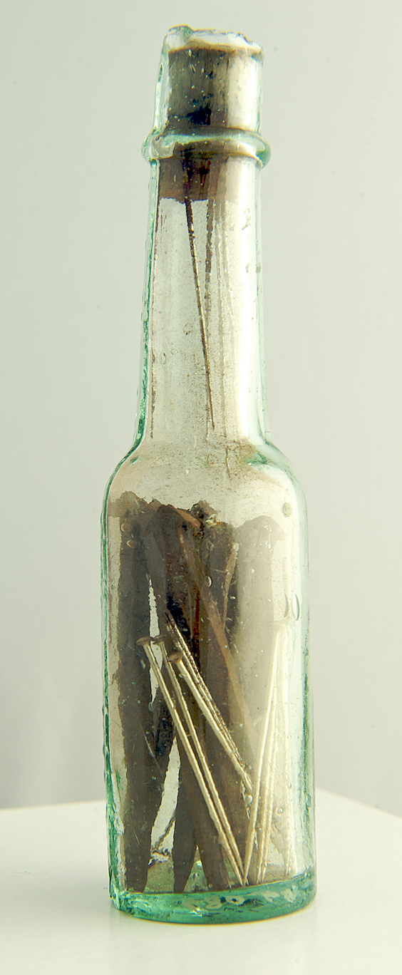 Securely corked witch bottle collected by Clarke containing nine new steel pins, needles and iron nails. Bellarmine bottles were sometimes used and also contained urine, hair and fingernail clippings of the person who had been bewitched ©Scarborough Museums Trust Photographer: David Chalmers