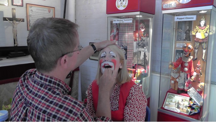 Mattie Faint, one of the clowns from Dalston Clowns Gallery, designing Helen's clown face.