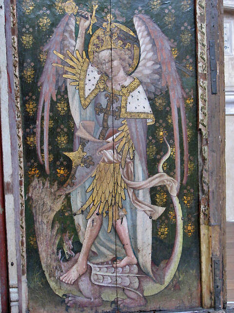 The rood screen in St Helen’s Church, Ranworth, depicts the archangel St Michael slaying the dragon. Michael was often depicted in armour or with a sword and shield, to indicate his martial responsibilities as leader of the heavenly host. Evelyn Simak, CC BY-SA 2.0, https://commons.wikimedia.org/w/index.php?curid=13394983