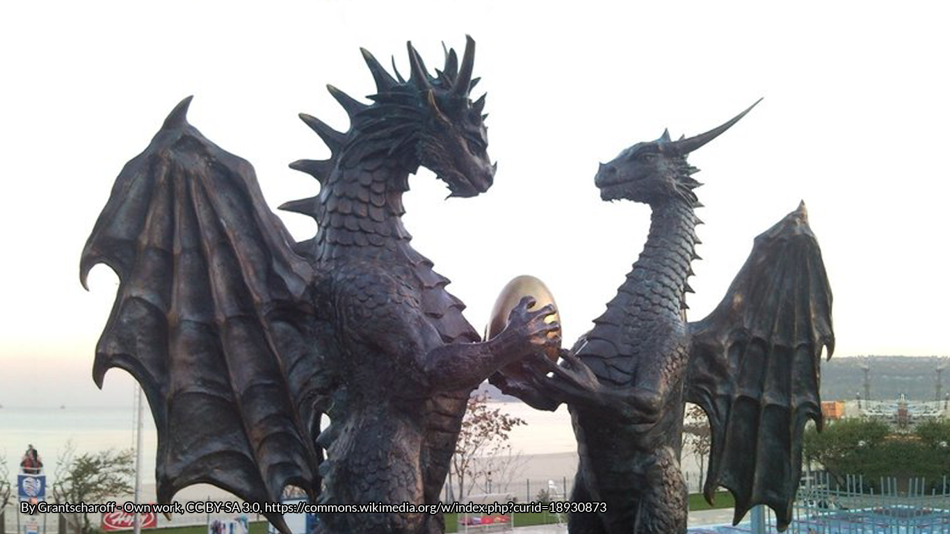 Statues of male and female dragons holding a dragon egg at Varna seaside